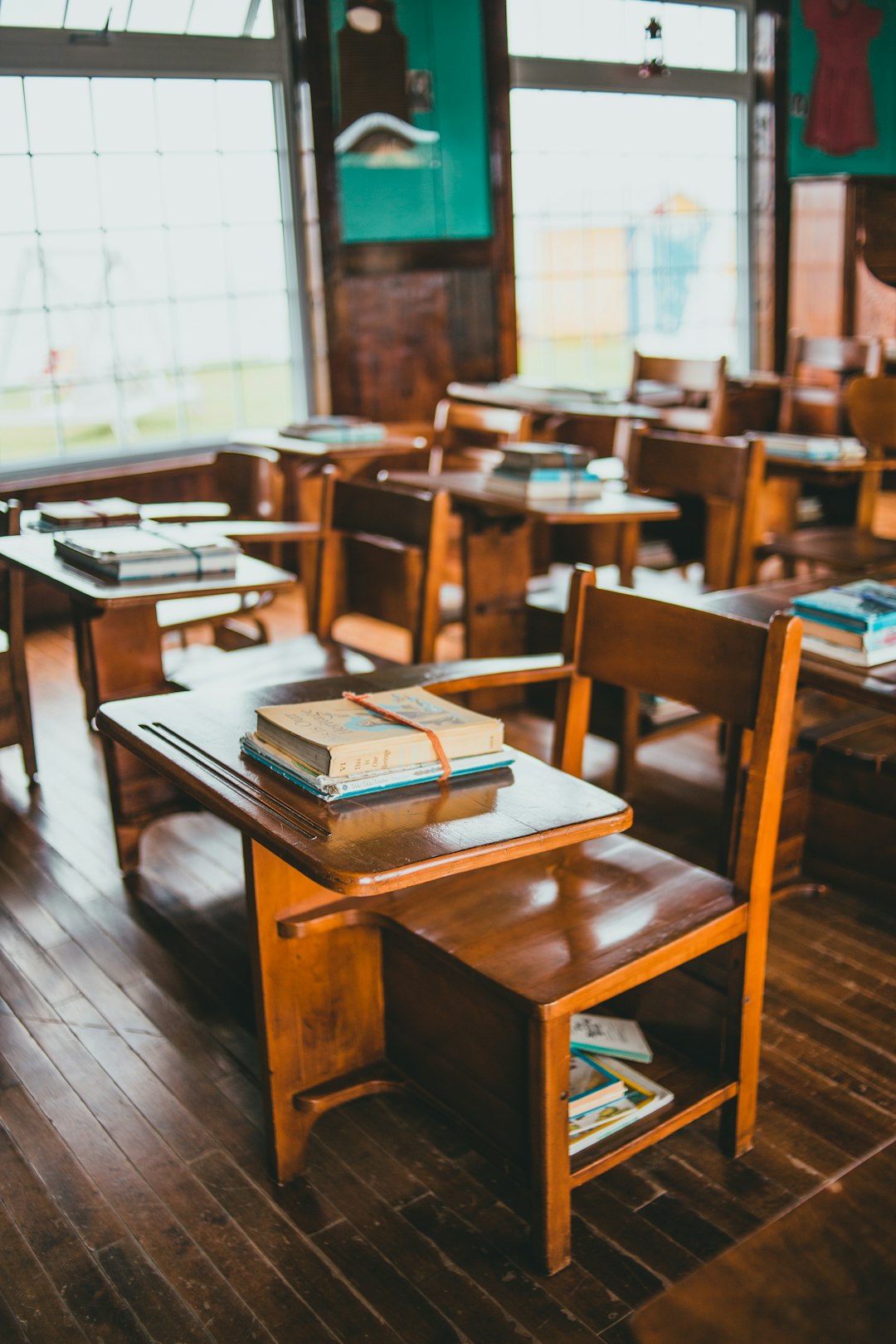 brown-wooden-table-with-books-on-top-fob-imujlqe